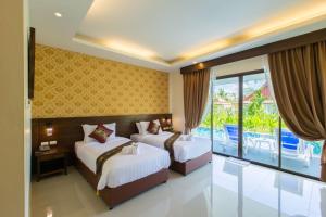 Postel nebo postele na pokoji v ubytování The Casita Phuket (SHA+)