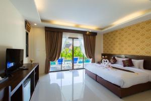 Postel nebo postele na pokoji v ubytování The Casita Phuket (SHA+)