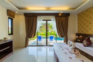 Postel nebo postele na pokoji v ubytování The Casita Phuket (SHA+)