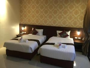Postel nebo postele na pokoji v ubytování The Casita Phuket (SHA+)
