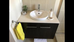 a bathroom with a sink and a counter top with a sink at 5 Star Room with own Bathroom - Singles, Couples, Families or Executives in Glen Waverley