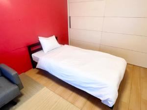 سرير أو أسرّة في غرفة في Hamamoto Palace Taniyama - Vacation STAY 11251