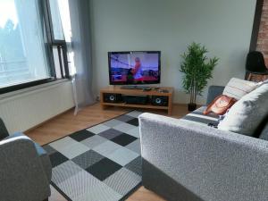 TV a/nebo společenská místnost v ubytování Herostreet Apartment 9