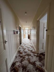 a hallway with a floor that is covered in water at The Crooked Cottage in Murtoa