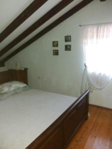 a bedroom with a bed and a window at Holiday house with a parking space Olib - 18805 in Olib