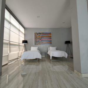 Ένα ή περισσότερα κρεβάτια σε δωμάτιο στο Family Room Gezonder Antapani