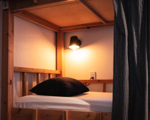 Postel nebo postele na pokoji v ubytování Next Chapter - Guesthouse - Kito