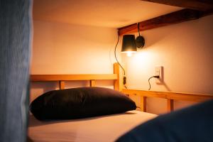Postel nebo postele na pokoji v ubytování Next Chapter - Guesthouse - Kito