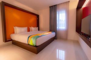 Voodi või voodid majutusasutuse Grand Picasso Hotel toas