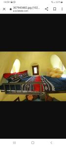 een slaapkamer met een groot bed met kussens erop bij Krka Fairytale Little Castle in Skradin