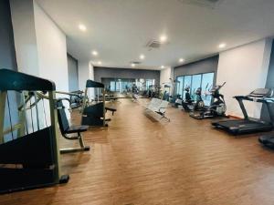 a gym with a bunch of treadmills and exercise bikes at SARI Homestay Vista Bangi with Wi-fi and Netflix in Bangi