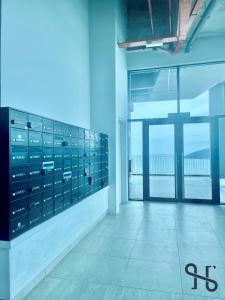 a room with a wall of lockers in a building at Homesuite' Home at Jesselton Quay in Kota Kinabalu