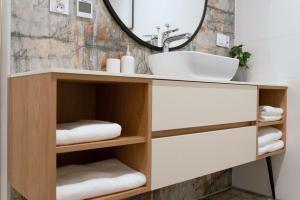 a bathroom with a sink and a mirror at Mięta in Wągrowiec