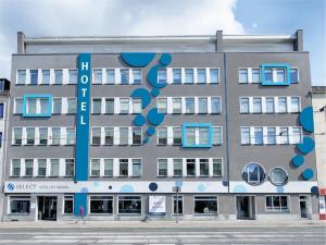 a building with a sign on the side of it at Select Hotel City Bremen in Bremen