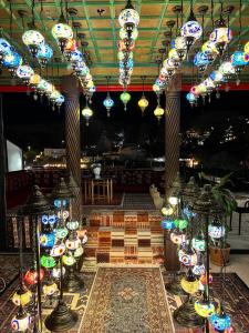 a room filled with lots of lights in a building at Olivia Cave Hotel in Göreme