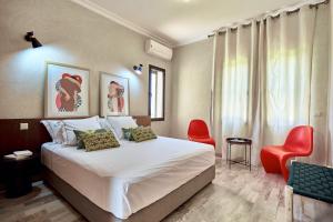 Ένα ή περισσότερα κρεβάτια σε δωμάτιο στο Villa Dar Belkiss