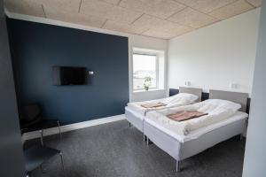 Postel nebo postele na pokoji v ubytování ICV SleepWell