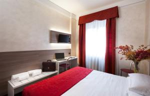 Postel nebo postele na pokoji v ubytování Hotel Gamma
