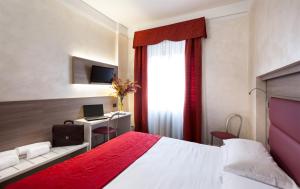 Postel nebo postele na pokoji v ubytování Hotel Gamma