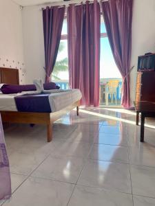 Postel nebo postele na pokoji v ubytování Coco Villa