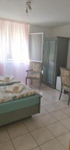 Postel nebo postele na pokoji v ubytování A u r o r a Central Room Climatizzata tra Locarno, Lugano e Bellinzona a 1 minuto FFS
