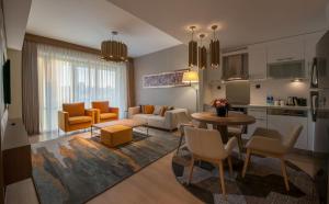 a living room with a couch and a table at The Superior Living Batışehir in Istanbul