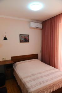 Postel nebo postele na pokoji v ubytování Janika apartments