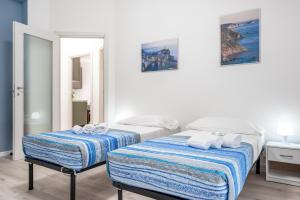 A bed or beds in a room at NEW APT! 1km from Central Station 'La Spezia'