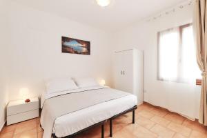 Postel nebo postele na pokoji v ubytování Casa Mazzini