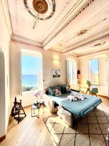 a large room with a bed and a large window at Corallini Luxury Apartments - Apartment Aka in Cervo