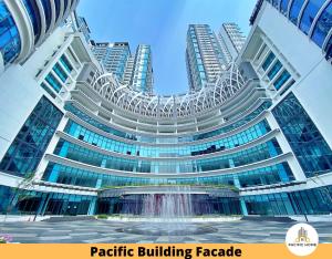 a large building with a fountain in front of it at Pacific Home Petaling Jaya @ The Curve, 1 Utama, Universiti Malaya in Petaling Jaya