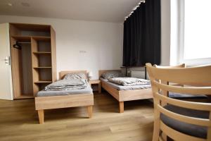 Ένα ή περισσότερα κρεβάτια σε δωμάτιο στο Zimmer24Frei Boardinghouse