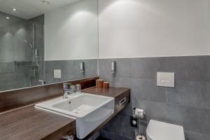 Koupelna v ubytování Garner Hotel Berlin - Spandau by IHG