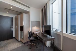 TV a/nebo společenská místnost v ubytování Garner Hotel Berlin - Spandau by IHG