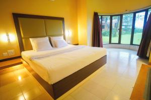 Postel nebo postele na pokoji v ubytování Treasure Island Resorts Lonavala