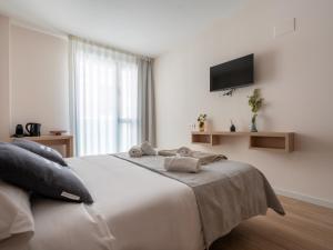 Posteľ alebo postele v izbe v ubytovaní limehome Barcelona Carrer de Besalú 82