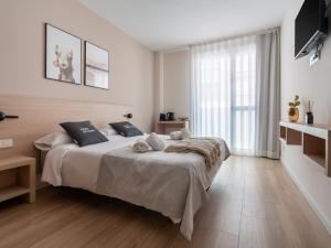 Posteľ alebo postele v izbe v ubytovaní limehome Barcelona Carrer de Besalú 82