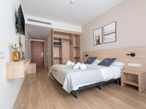 Posteľ alebo postele v izbe v ubytovaní limehome Barcelona Carrer de Besalú 82