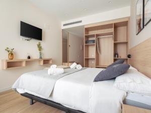 Posteľ alebo postele v izbe v ubytovaní limehome Barcelona Carrer de Besalú 82 + 37 fotografií