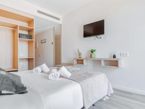 Posteľ alebo postele v izbe v ubytovaní limehome Barcelona Carrer de Besalú 82
