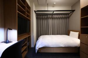 Voodi või voodid majutusasutuse Dormy Inn Okayama Natural Hot Spring toas