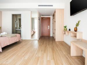 Posteľ alebo postele v izbe v ubytovaní limehome Barcelona Carrer de Besalú 82