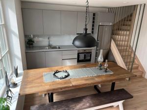 a kitchen with a wooden table in a room at New cabin in fabulous Idre activity area in Idre