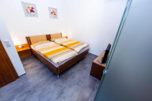 Postel nebo postele na pokoji v ubytování Pension La Mamma