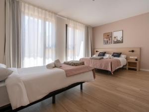 Posteľ alebo postele v izbe v ubytovaní limehome Barcelona Carrer de Besalú 82