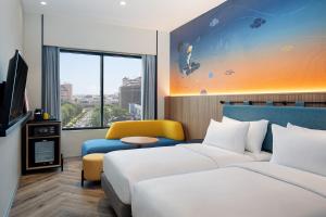 Krevet ili kreveti u jedinici u objektu ibis Styles Semarang Simpang Lima