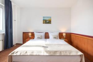 Postel nebo postele na pokoji v ubytování Hotel Aldea Berlin + 29 fotografií