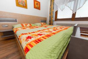 Postel nebo postele na pokoji v ubytování Pension La Mamma