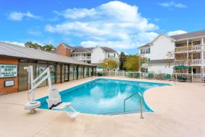 a swimming pool at a apartment complex at Ellington at Wachesaw Plantation East a Ramada by Wyndham in Myrtle Beach
