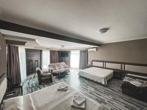 Voodi või voodid majutusasutuse Discovery Hotel toas